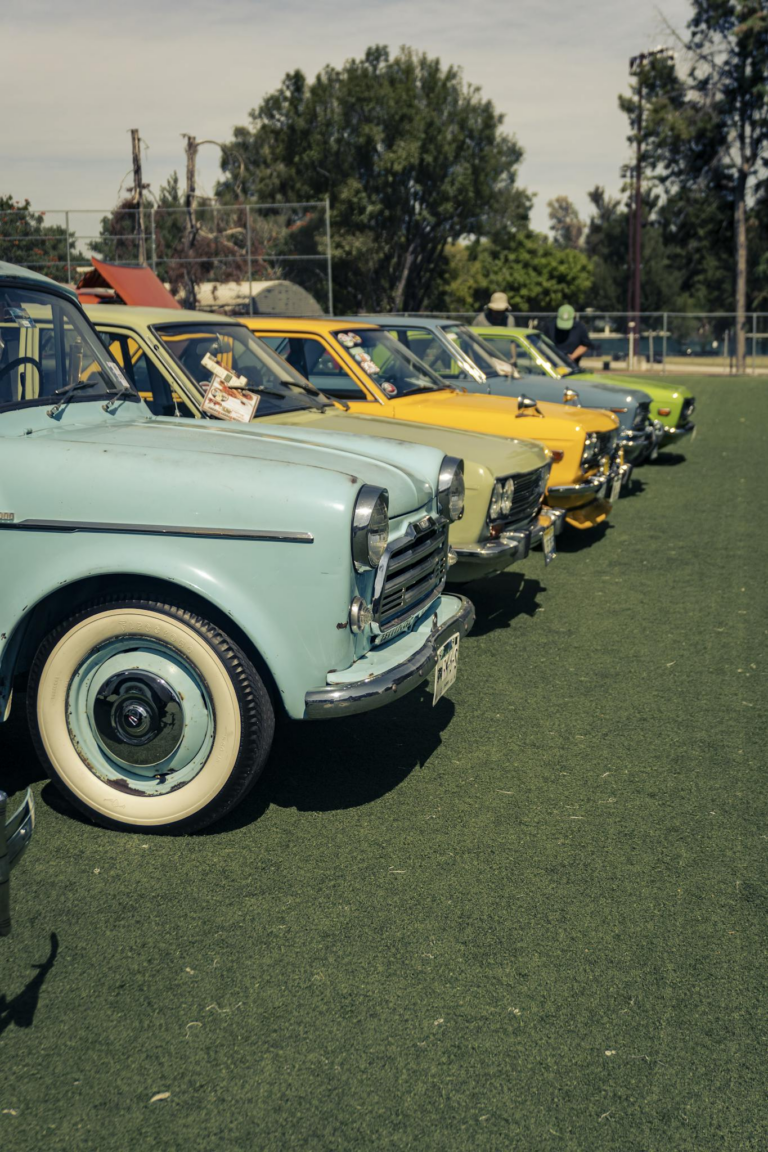 An array of vintage cars showcased outdoors in Zapopan, Mexico, under a sunny sky.